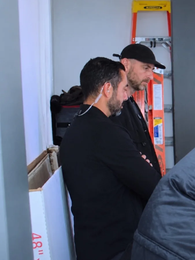 Tony Carrasco watching the Khloé in Wonder Land shoot with an earpiece in